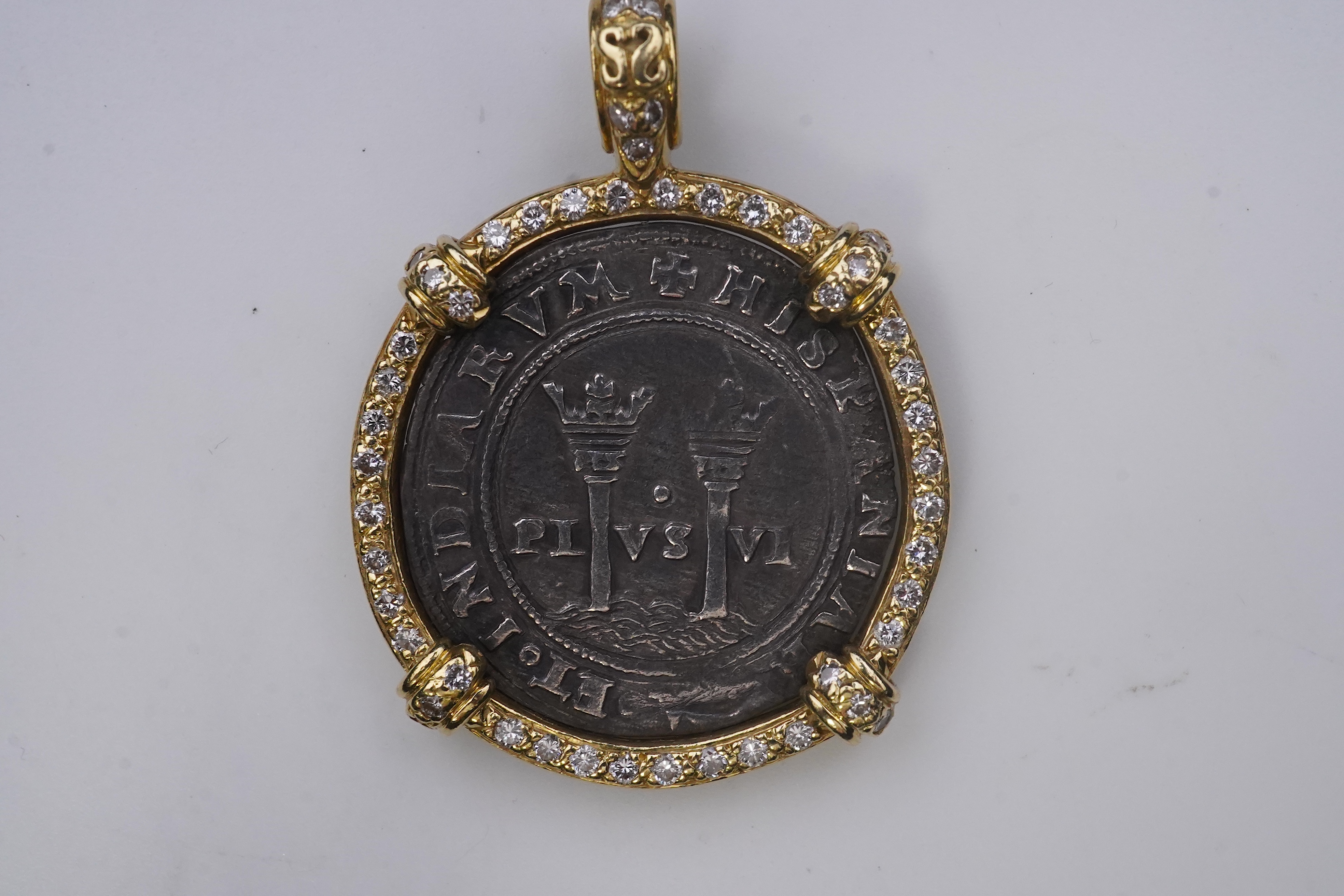 An unusual diamond and 16th century Mexican coin pendant